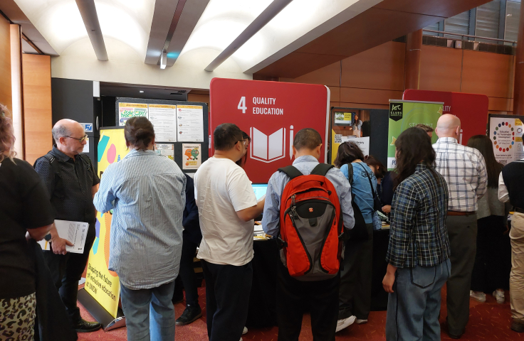 People gather at a stall at UNSW